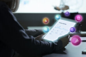 What is digital marketing? A professional analyzing website analytics on a tablet with floating SEO, social media, web analytics, and online marketing icons.